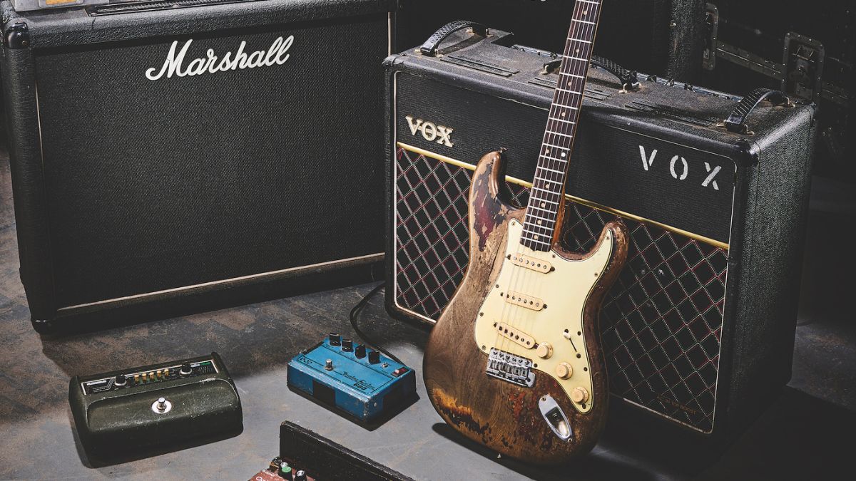 Rory Gallagher&#039;s Stratocaster, stood against a Vox amplifier