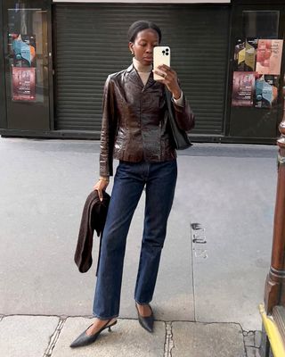 french woman wearing brown leather jacket outfit