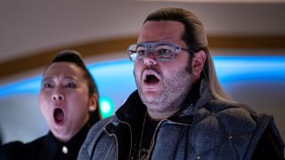 Josh Gad and Suzy Nakamura stand with faces of massive shock in Avenue 5.