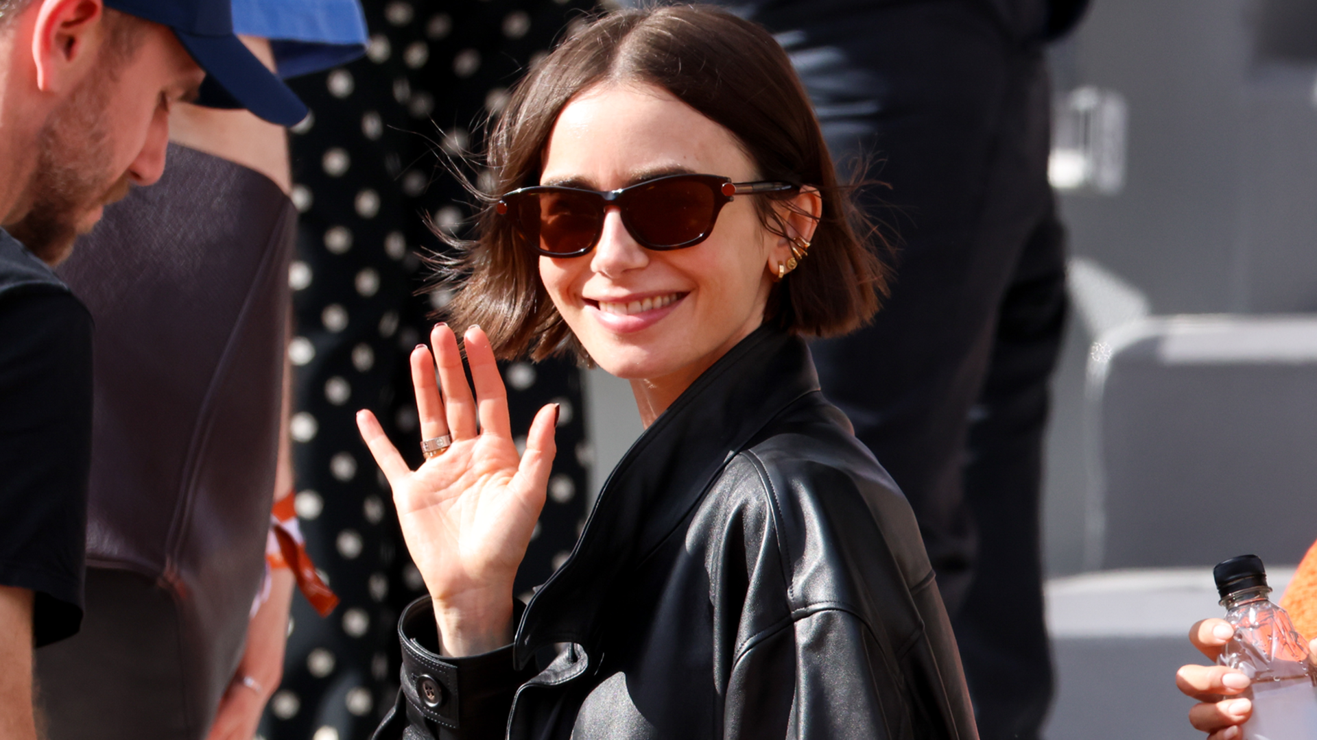Lily Collins was spotted at the 2026 French Open in an oversize leather bomber jacket