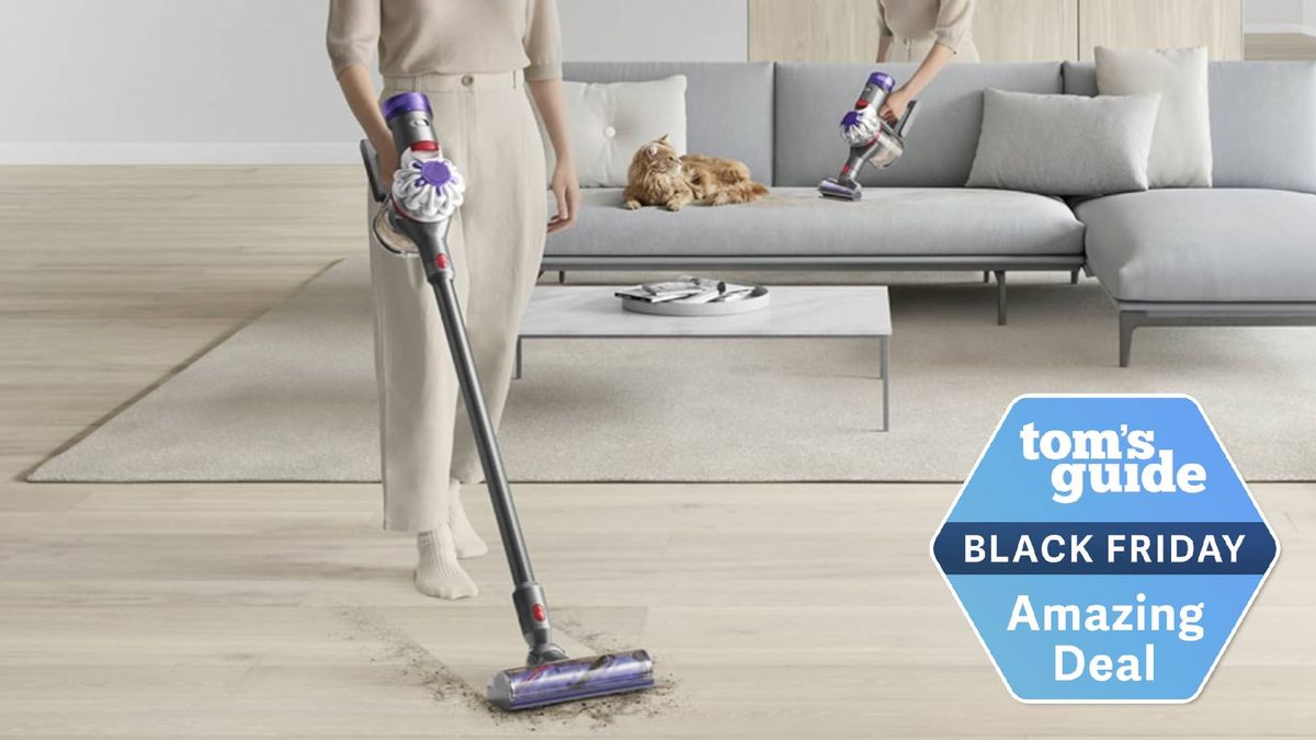 Woman hoovering with the Dyson V8 Plus