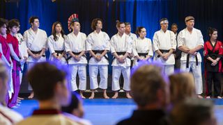 Gianni DeCenzo as Demetri, Oona O’Brien as Devon, Jacob Bertrand as Eli 'Hawk' Moskowitz, Xolo Maridueña as Miguel Diaz, Tanner Buchanan as Robby Keene, Mary Mouser as Samantha LaRusso, Ralph Macchio as Daniel LaRusso, William Zabka as Johnny Lawrence in episode 606 of in Cobra Kai