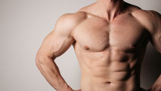 Up close image of male topless showing muscles