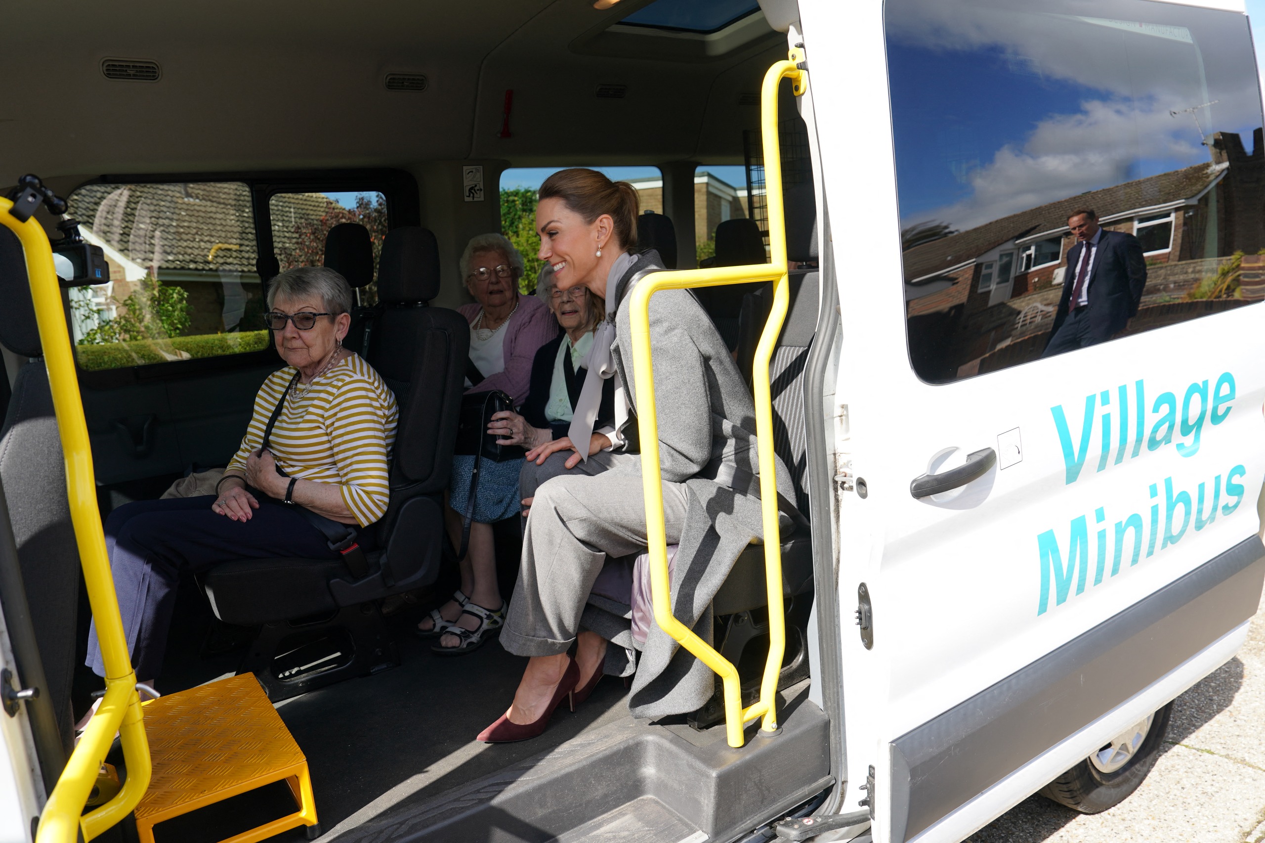 Princess Kate riding in a minibus with senior citizens