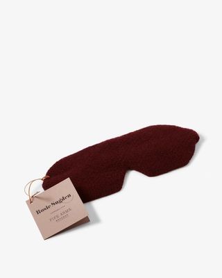 A burgundy cashmere eye mask from Rosie Sugden x Fife Arms