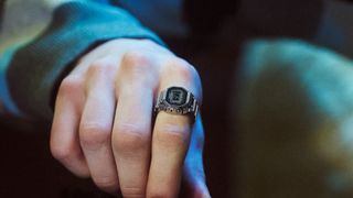 The Casio CRW-001-1JR smart ring being worn on a finger.