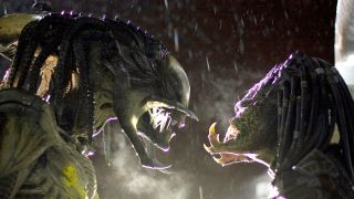 two aliens stare at one another; both have large tusks and dreadlocks, while the one on the left has an elongated skull