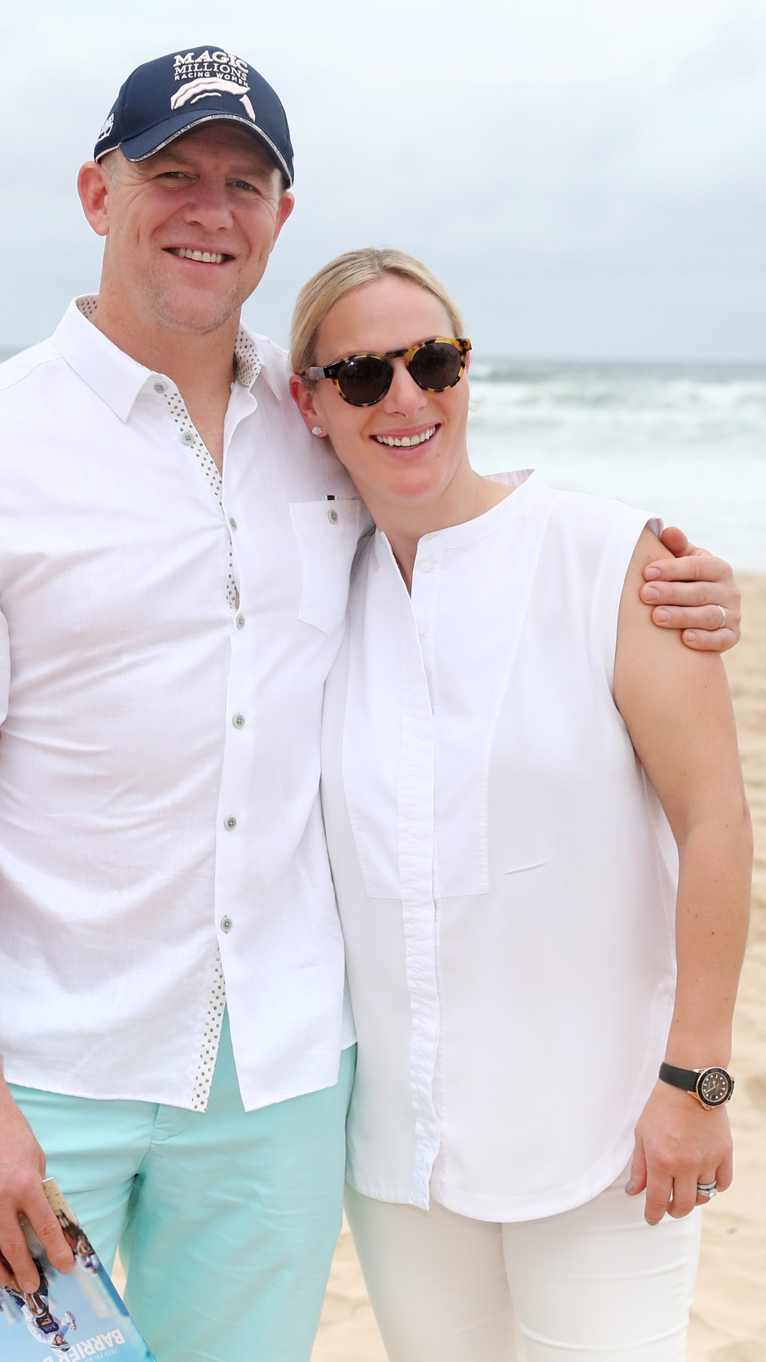 Zara and Mike Tindall smile as they attend the 2019 Magic Millions official draw
