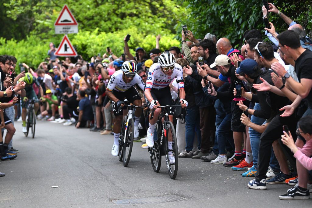 TORINO ITALY MAY 04 Jhonatan Narvaez of Ecuador and Team INEOS Grenadiers and Tadej Pogacar of Slovenia and UAE Team Emirates compete in the breakaway while fans cheer during the 107th Giro dItalia 2024 Stage 1 a 140km stage from Venaria Reale to Torino UCIWT on May 04 2024 in Torino Italy Photo by Dario BelingheriGetty Images