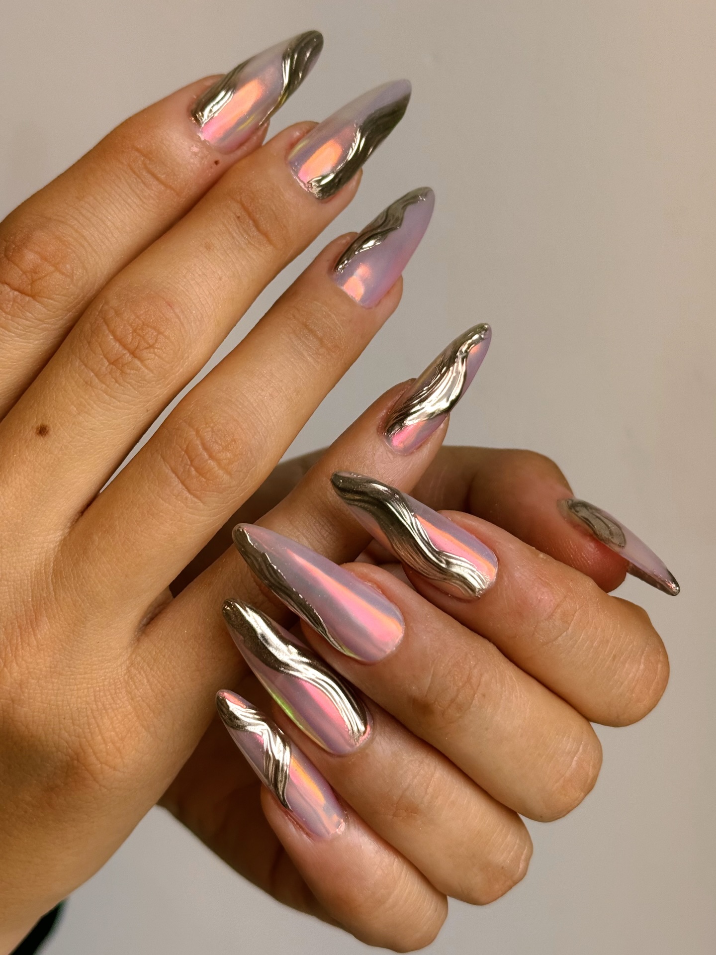 Three-dimensional chrome manicure.