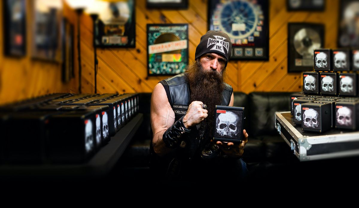 Zakk Wylde holds his new, limited-edition signature Positive Grid Spark Mini amp