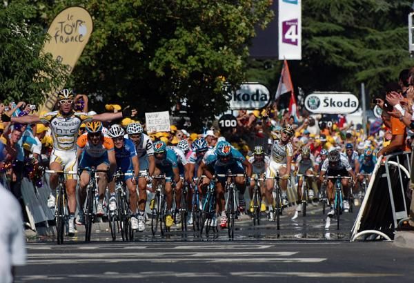 As Cavendish sprints to victory, a Team Columbia-HTC teammate celebrates.