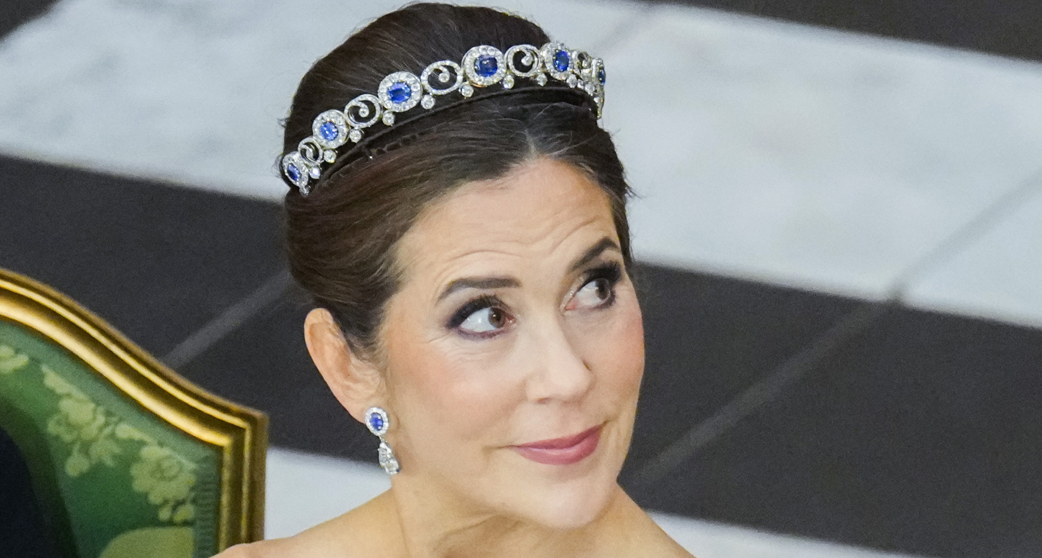 Queen Mary wearing a blue dress and sapphire tiara