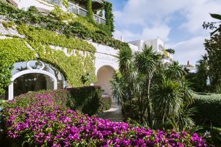 The ivy-covered exterior of Capri Palace hotel in Anacapri