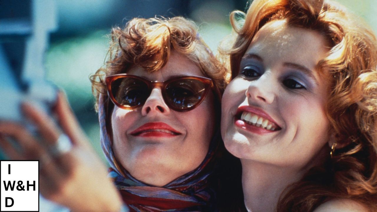 still from thelma &amp; louise movie of the two main characters taking a photo with woman&amp;home international women&#039;s day logo in the bottom left corner