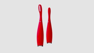 Image shows the front and back of a red Foreo ISSA 3 sonic toothbrush