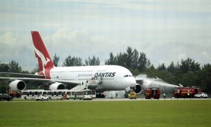 A Qantas A380 makes a safe emergency landing in Singapore after suffering engine failure just after take off.