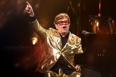 Elton John in a gold suit