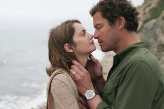 a couple kisses by the ocean on a cliff in the tv show the affair