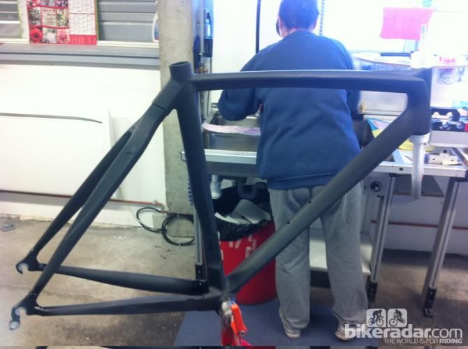 A raw frame awaits its decals and masks before the final paintjob