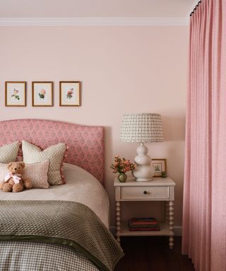 bedroom with pink color scheme and traditional decor