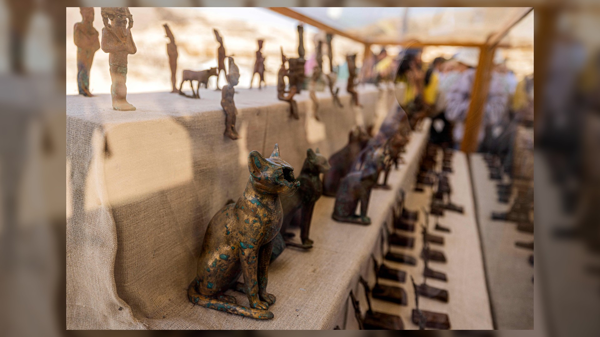 Statuettes and figurines depicting cats and Egyptian deities have been found in a cache from the Late Egyptian period (around the 5th century BC). There are many bronze statues depicting various Egyptian gods and goddesses such as Bastet, Anubis, Osiris, Amunmeen, Isis, Nefertum and Hathor.