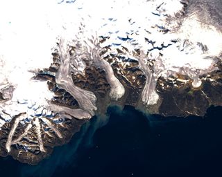 Landsat 7 ETM+ satellite image of the south-east Devon Island Ice Cap, Devon Island, Nunavut, Canada. The darker ice is the result of accumulated impurities at the surface.