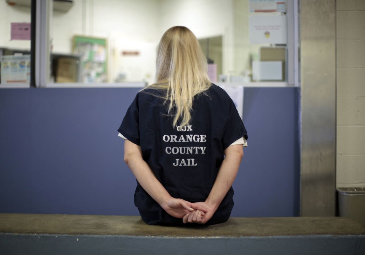 A female inmate is checked into the Orange County jail in Santa Ana, California.