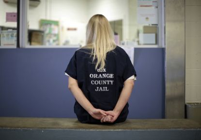 A female inmate is checked into the Orange County jail in Santa Ana, California.