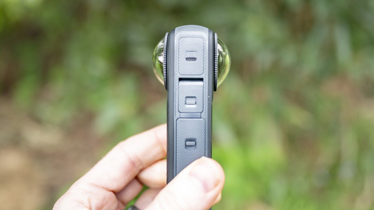 Side view of the Insta360 X4 360 degree camera with lens protectors