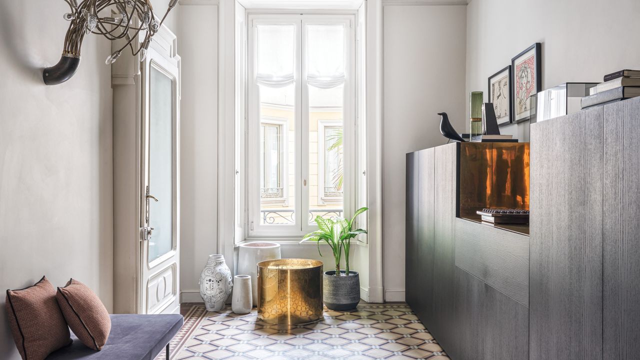 Wide hallway with tiled floor, built-in storage and bench