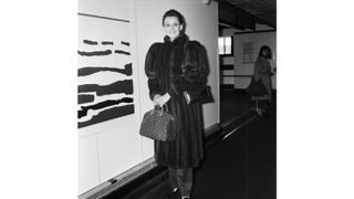 Audrey Hepburn with her Louis Vuitton bag