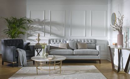 Harrods furniture including a chair in dark grey and sofa in light grey with furnishings. 