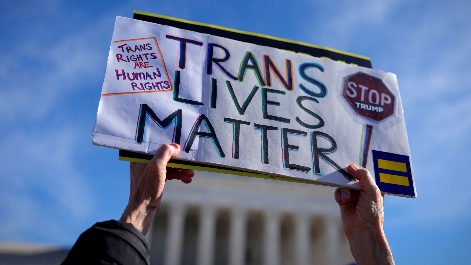 Protesters support transgender rights outside the Supreme Court