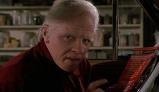 Back To The Future Part II Old Biff in the driver's seat with the almanac