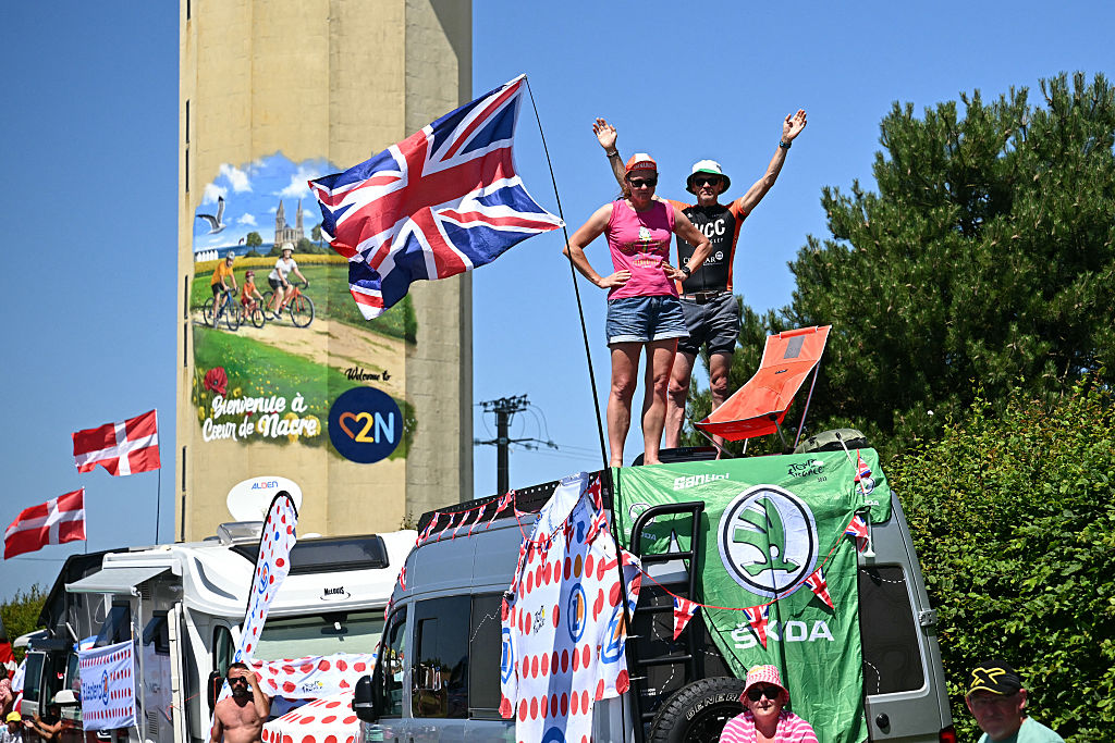 Spectators line along the race route during the 5th stage of the 112th edition of the Tour de France cycling race, 33 km individual time trial starting and finishing in Caen, northwestern France, on July 9, 2025. (Photo by Loic VENANCE / AFP) (Photo by LOIC VENANCE/AFP via Getty Images)