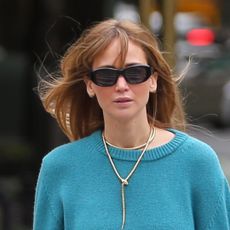 Jennifer Lawrence in New York City wearing the aqua color trend, transitional fall loafers, and carrying a rare Hermes Kelly bag