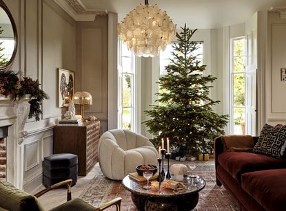 A real Christmas tree in a luxurious living room