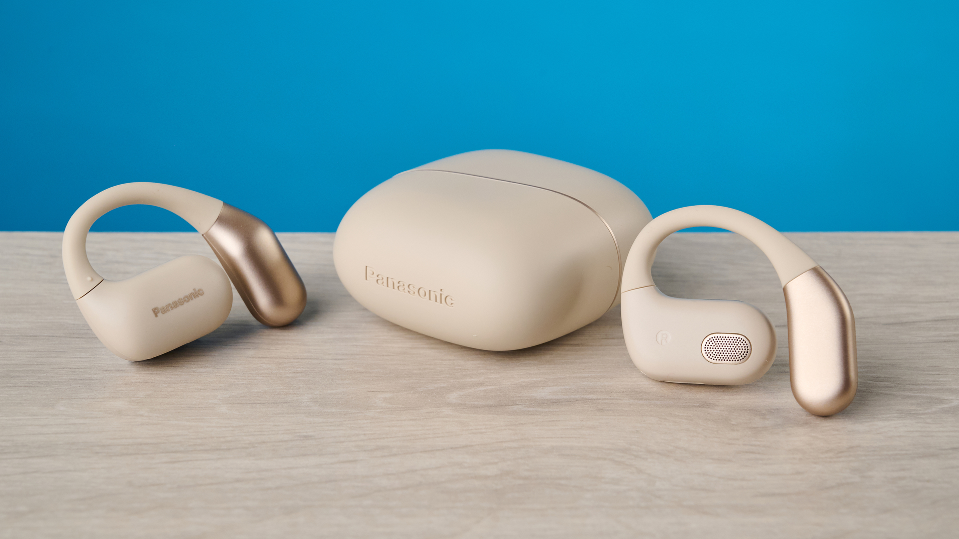 Panasonic RB-F10 in beige photographed in front of a blue background