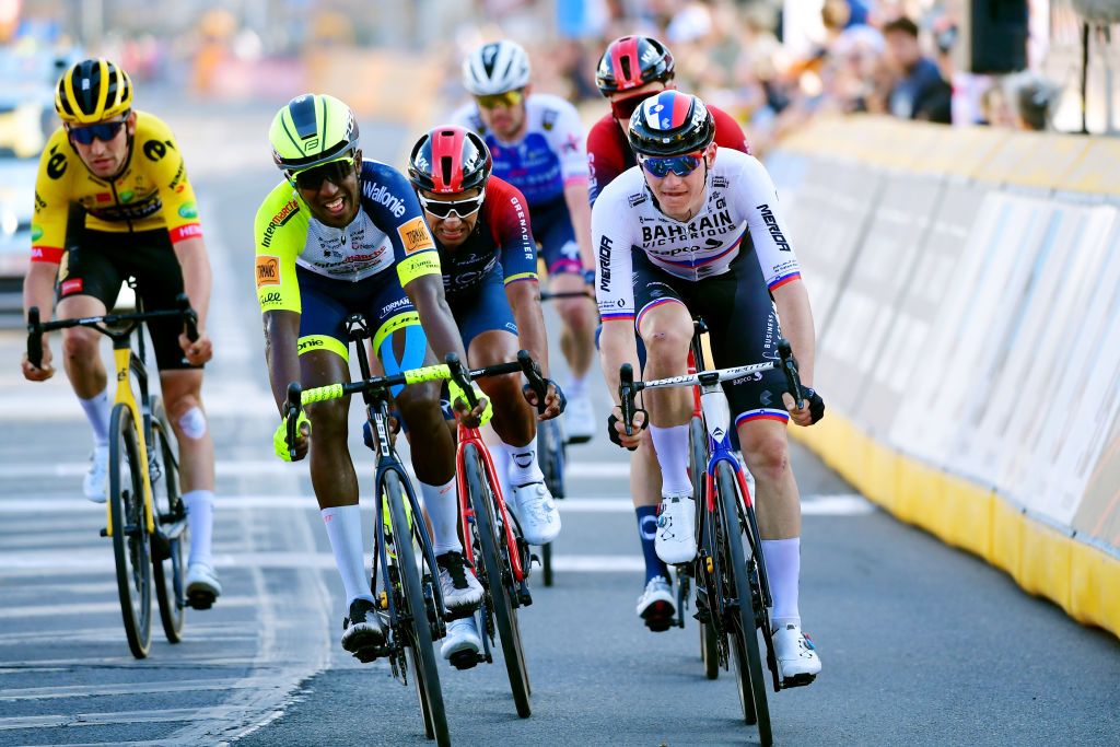 HARELBEKE BELGIUM MARCH 25 LR Hailu Biniam Girmay of Eritrea and Team Intermarch Wanty Gobert Matriaux and Matej Mohoric of Slovenia and Team Bahrain Victorious cross the finish line during the 65th E3 Saxo Bank Classic 2022 a 2039km one day race from Harelbeke to Harelbeke E3SaxobankClassic WorldTour on March 25 2022 in Harelbeke Belgium Photo by Tim de WaeleGetty Images