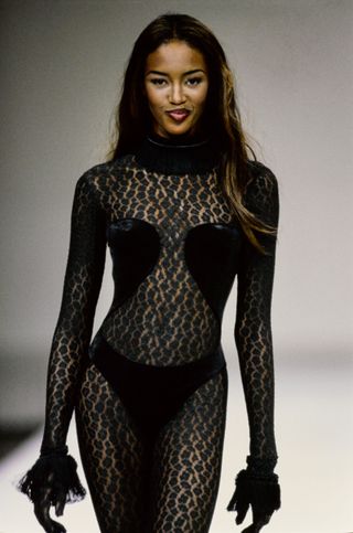 Naomi Campbell wears an Alaia catsuit