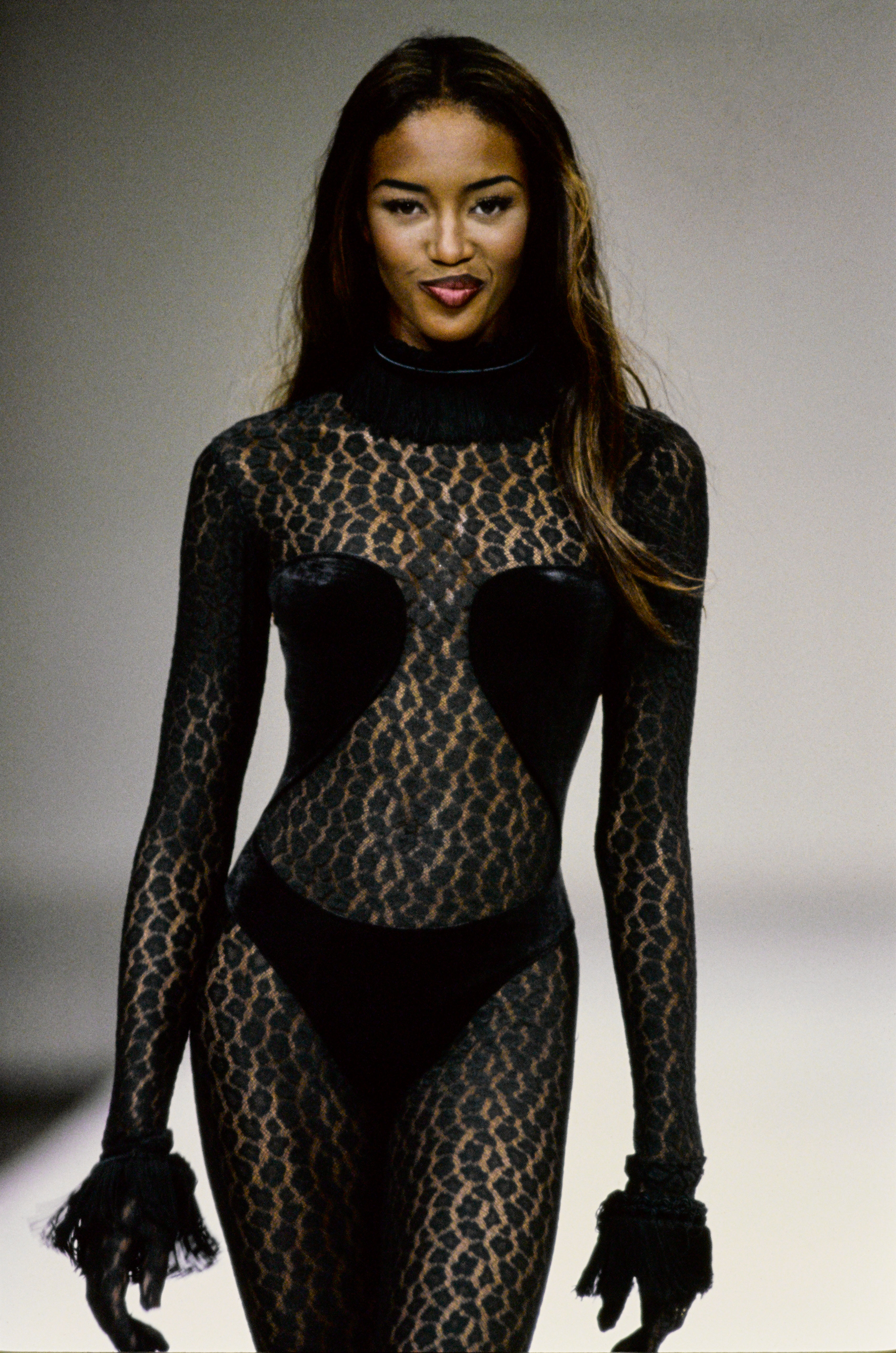 Naomi Campbell wears an Alaia catsuit