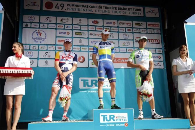 Aidis Kruopis (Orica-GreenEdge) on the podium, flanked by Andre Greipel (Lotto Belisol) and Marco Coledan (Bardiani Valvole-CSF Inox).