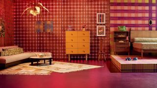 Wooden drawers, red wallpaper, sofa