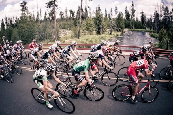 The mens peloton crosses the Little Deschutes River