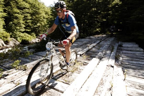 A Trans Andes racer crosses a bridge.