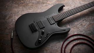 Close up of the body on the Ibanez Iron Label AZ41B1 electric guitar lying on a sheet of wood