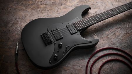 Close up of the body on the Ibanez Iron Label AZ41B1 electric guitar lying on a sheet of wood