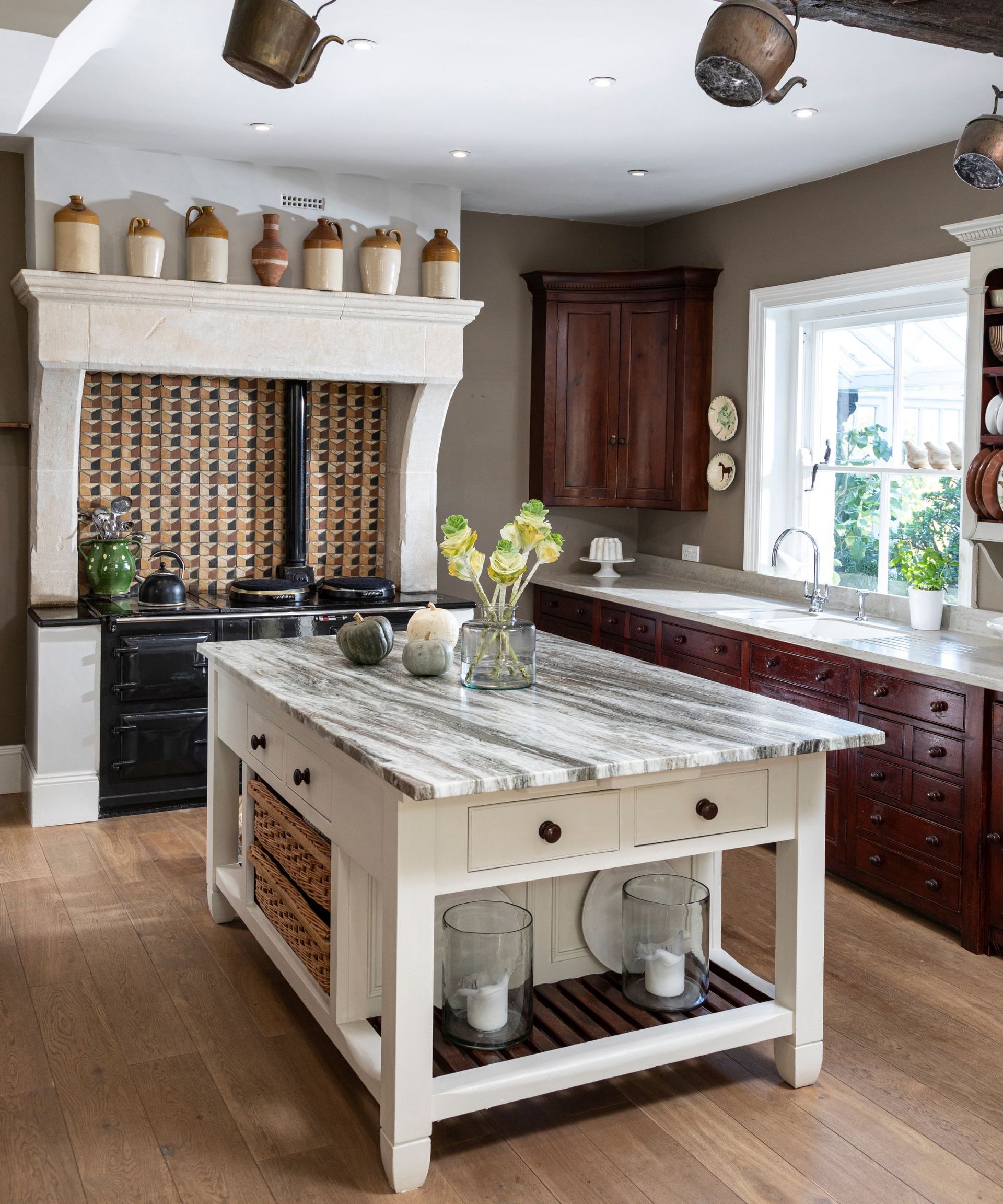 A traditional white kitchen with marble countertops