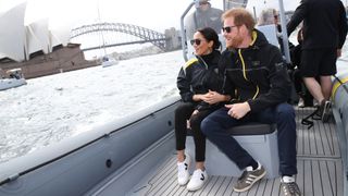Prince Harry, Duke of Sussex and Meghan, Duchess of Sussex on Sydney Harbour looking out at Sydney Opera House
